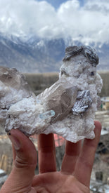 Smoky quartz on albite matrix with aquamarine and star Muscovite flower